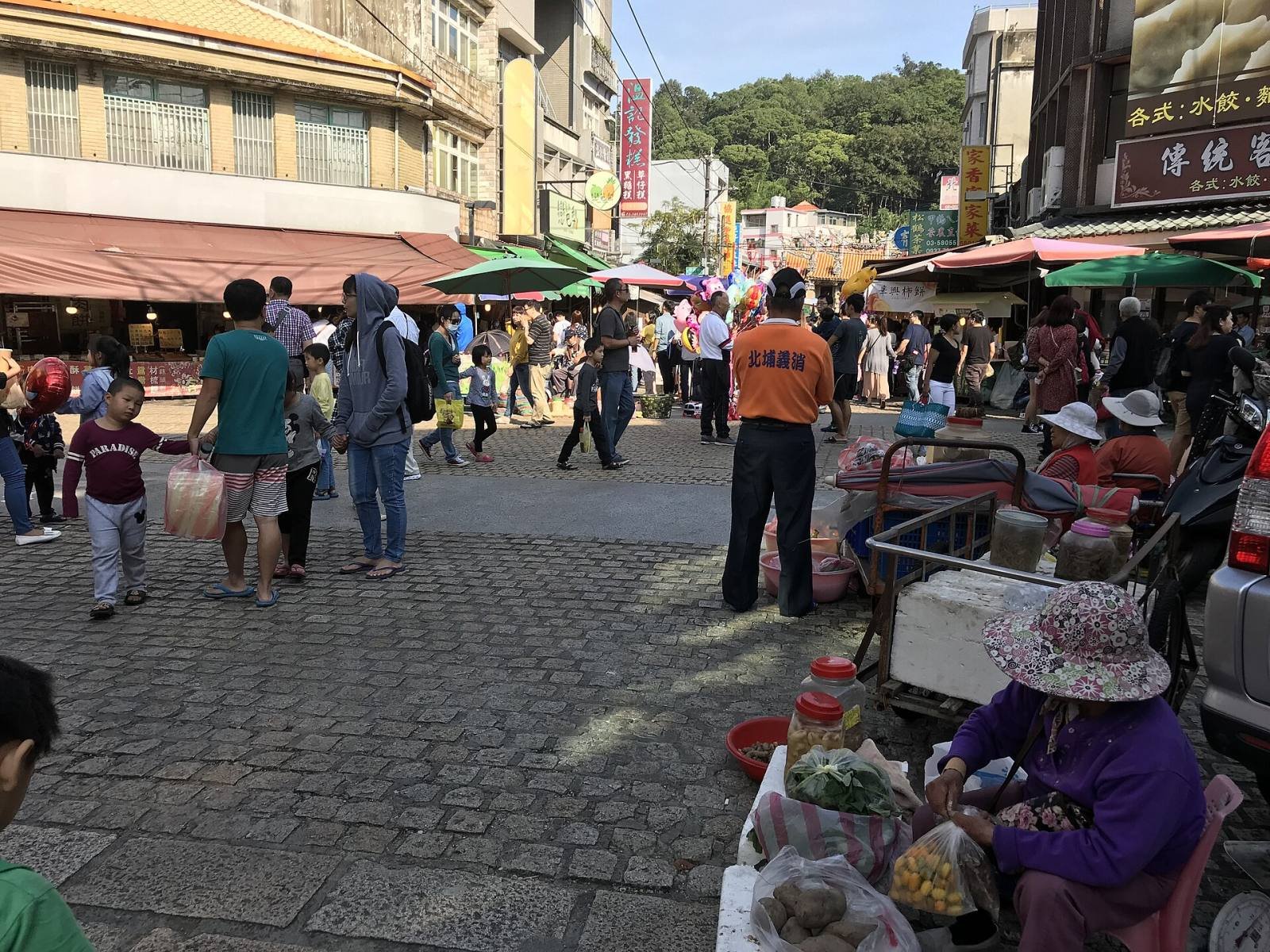 The old street of Beipu leading to the Citian Temple, lined with market stalls