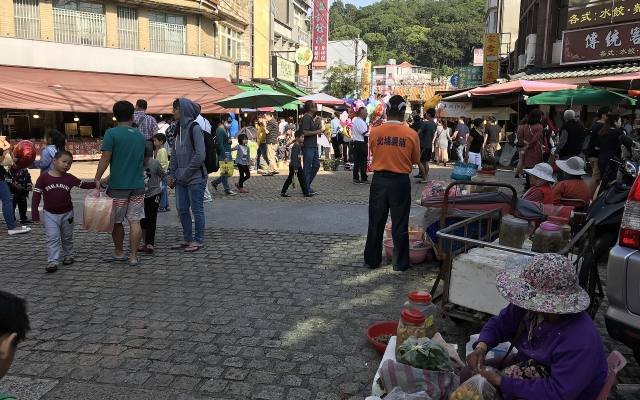 The old street of Beipu leading to the Citian Temple, lined with market stalls
