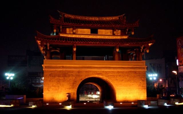 The East Gate of Hsinchu glowing orange at night